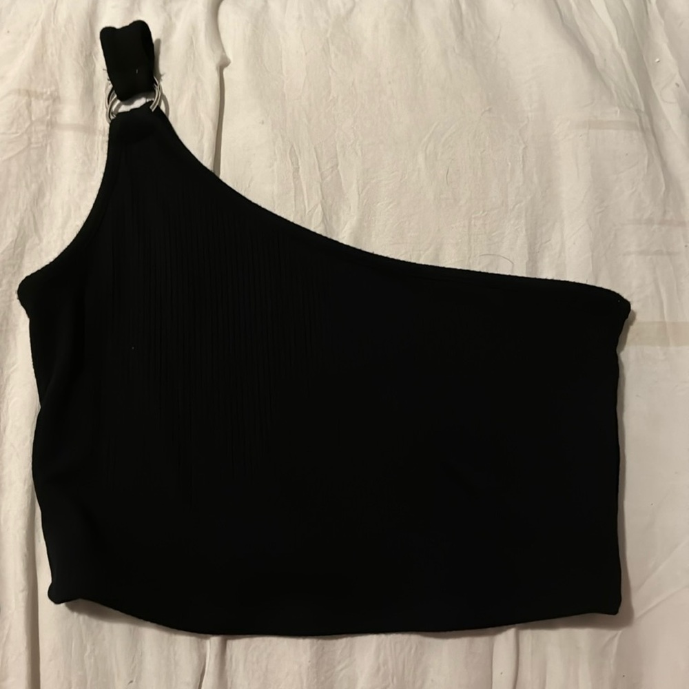 Black one shoulder top. Silver key hole detail on shoulder